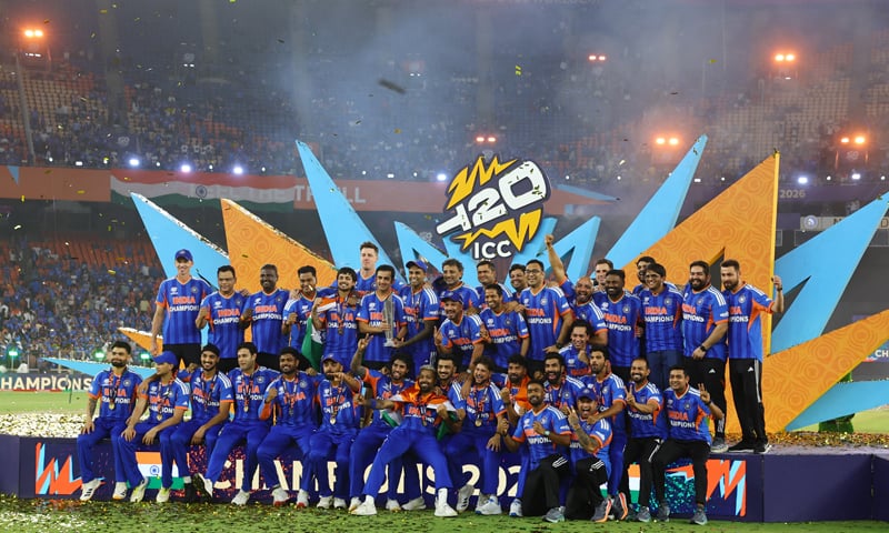 AHMEDABAD: Members of the Indian squad celebrate with the trophy on the podium after beating New Zealand in the final at the Narendra Modi Stadium on Sunday.&mdash;Reuters