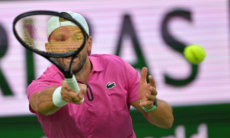 BULGARIA&rsquo;S Grigor Dimitrov hits a return against Carlos Alcaraz of Spain during their Indian Wells second-round match at the Indian Wells Tennis Garden.&mdash;Reuters