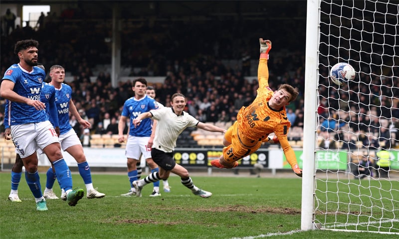 STOKE-ON-TRENT: Port Vale’s Ben Waine (second R) scores past Sunderland goalkeeper Melker Ellborg during their FA Cup fifth-round match at Vale Park.—Reuters STOKE-ON-TRENT: Port Vale’s Ben Waine (second R) scores past Sunderland goalkeeper Melker Ellborg during their FA Cup fifth-round match at Vale Park.—Reuters