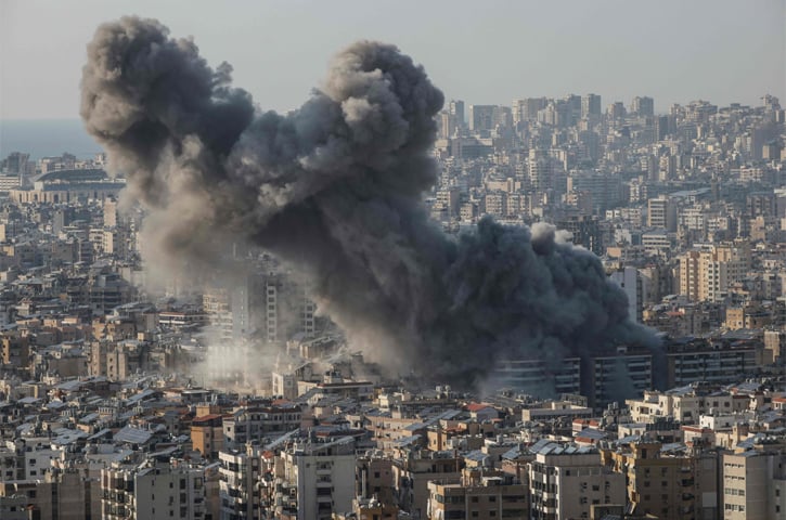  Smoke rises from the site of an Israeli air strike that targeted an area in the southern suburbs of Beirut.&mdash;AFP 