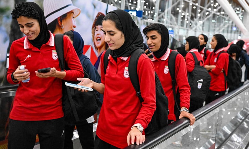 Members of Iran&rsquo;s women football team arrive at the Kuala Lumpur International Airport after taking part in the Asian Cup in Australia.&mdash;AFP