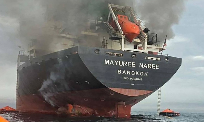 This photo, released by the Royal Thai Navy, shows smoke rising from the Thai bulk carrier &lsquo;Mayuree Naree&rsquo; near the Strait of Hormuz after an attack. Around 20 crew members have been rescued so far.&mdash;AFP