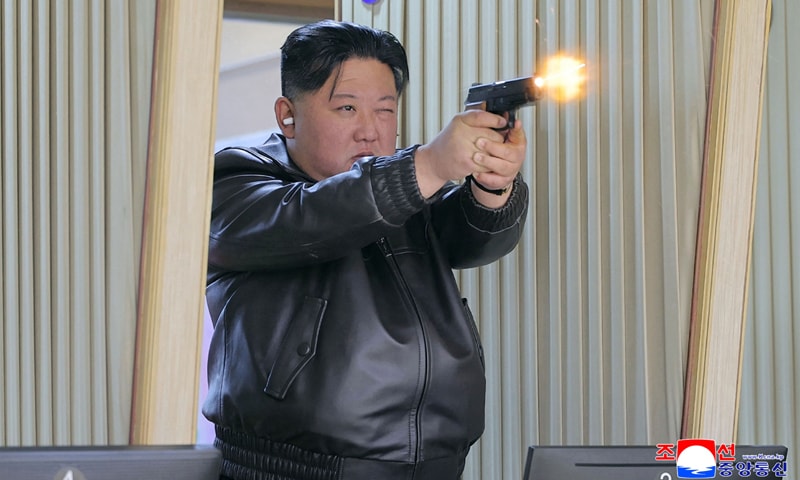 Kim Jong Un test-fires a new pistol in a shooting gallery at an undisclosed location in North Korea.&mdash;AFP