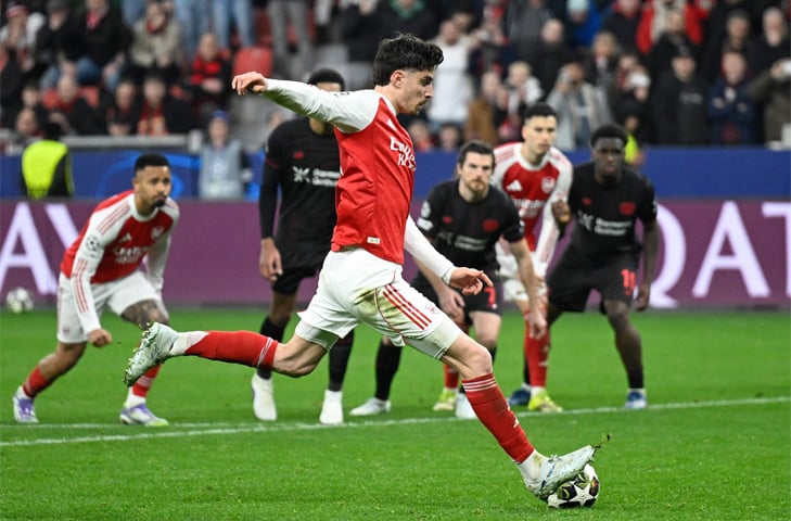  LEVERKUSEN: Arsenal&rsquo;s Kai Havertz scores from the penalty spot against Bayer Leverkusen during their round-of-16 first leg at the BayArena.&mdash;AFP 