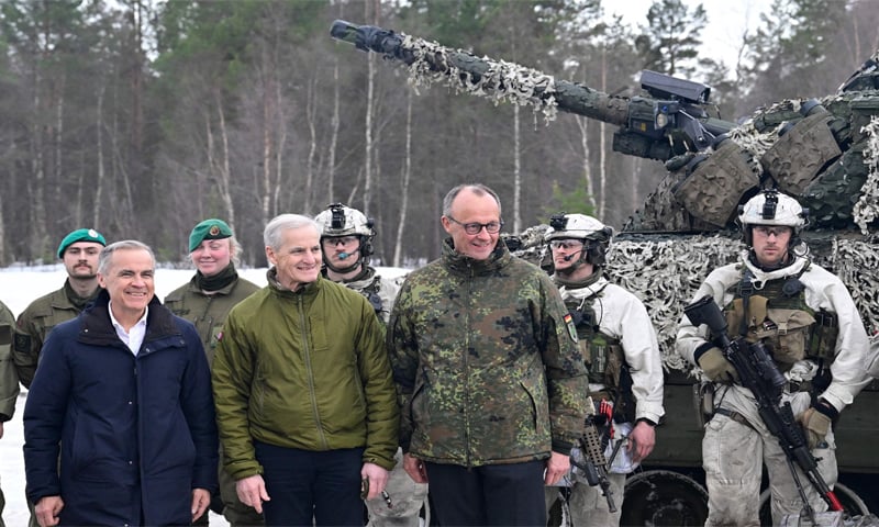(From left) Canadian Prime Minister Mark Carney, Norway’s Prime Minister Jonas Gahr Stoere and German Chancellor Friedrich Merz pose with soldiers in front of a tank at an airbase in Norway. The three leaders visited the Arctic in the midst of a large Nato exercise. — AFP (From left) Canadian Prime Minister Mark Carney, Norway’s Prime Minister Jonas Gahr Stoere and German Chancellor Friedrich Merz pose with soldiers in front of a tank at an airbase in Norway. The three leaders visited the Arctic in the midst of a large Nato exercise. — AFP