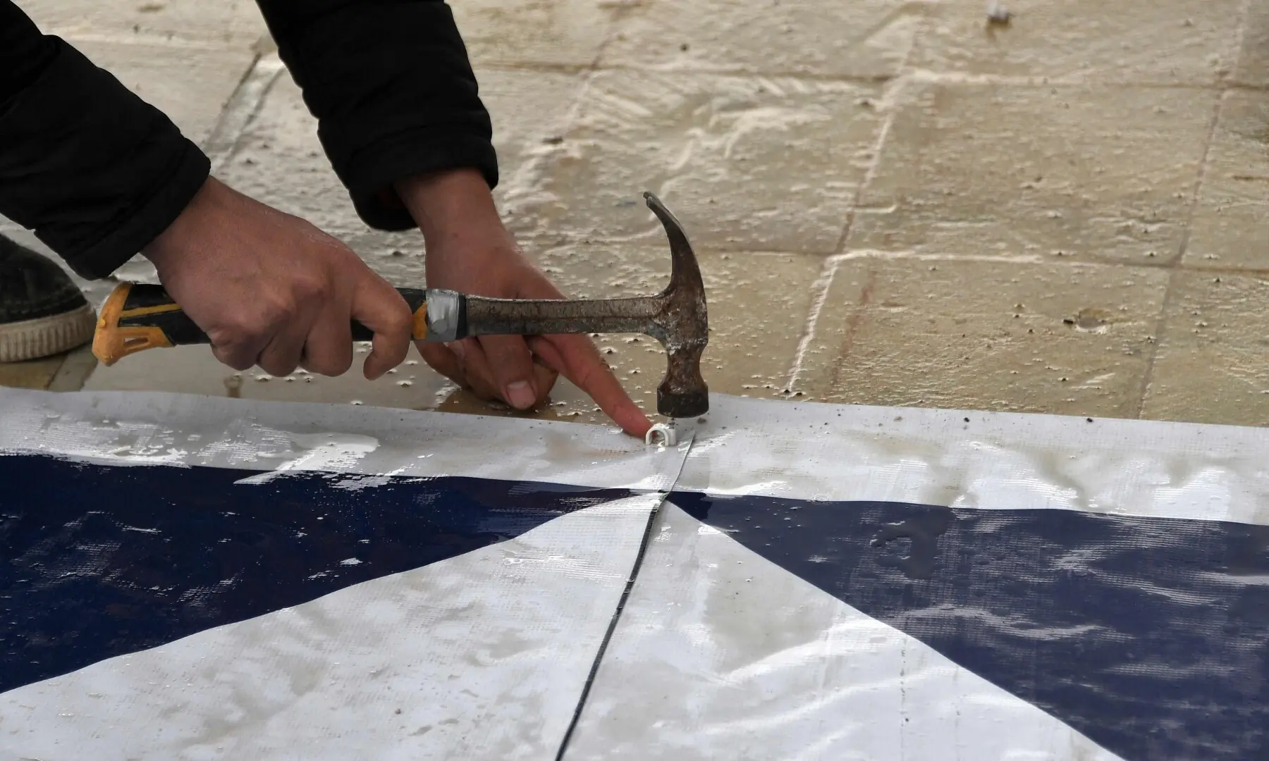 Archaeologists add the &ldquo;Blue Shield&rdquo; sign to signify cultural sites protected by the 1954 Hague Convention to a heritage site in the old city of Mosul, Iraq on March 31. &mdash; AFP