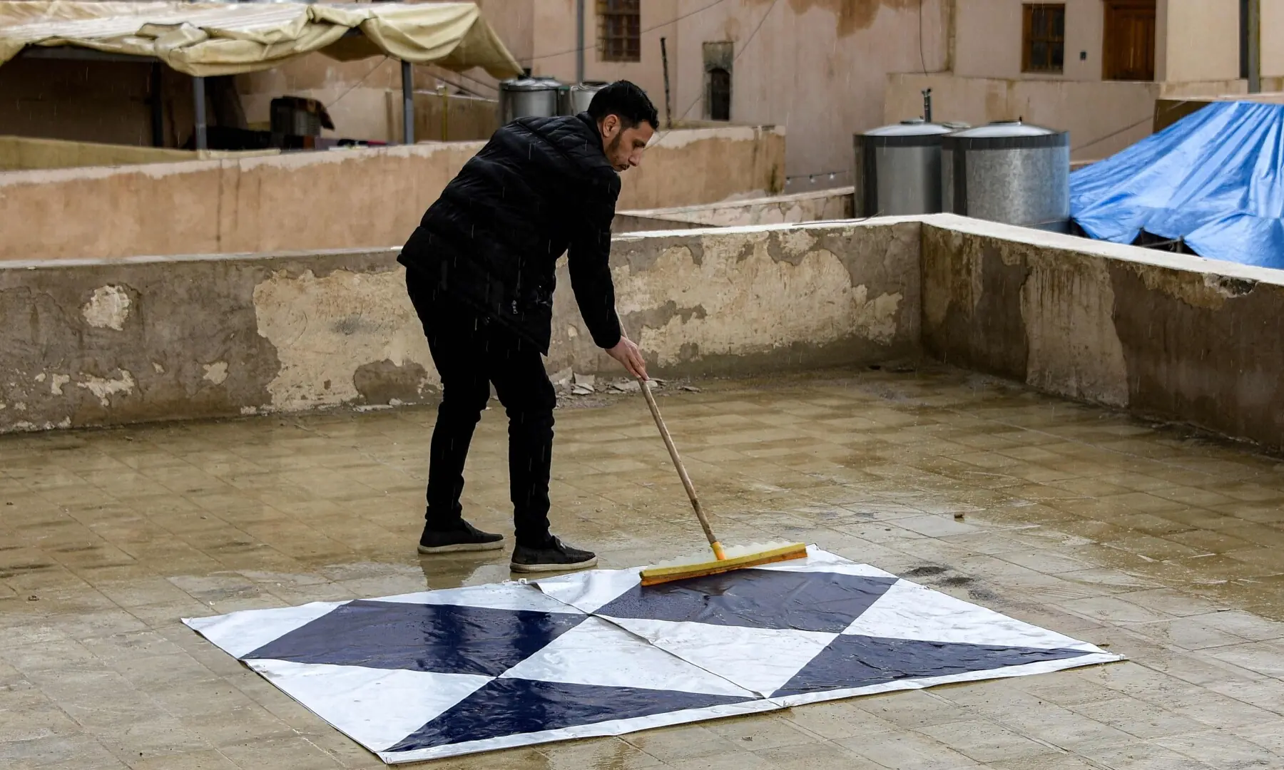An archaeologist adds the &ldquo;Blue Shield&rdquo; sign to signify cultural sites protected by the 1954 Hague Convention to a heritage site in the old city of Mosul, Iraq on March 31. &mdash; AFP