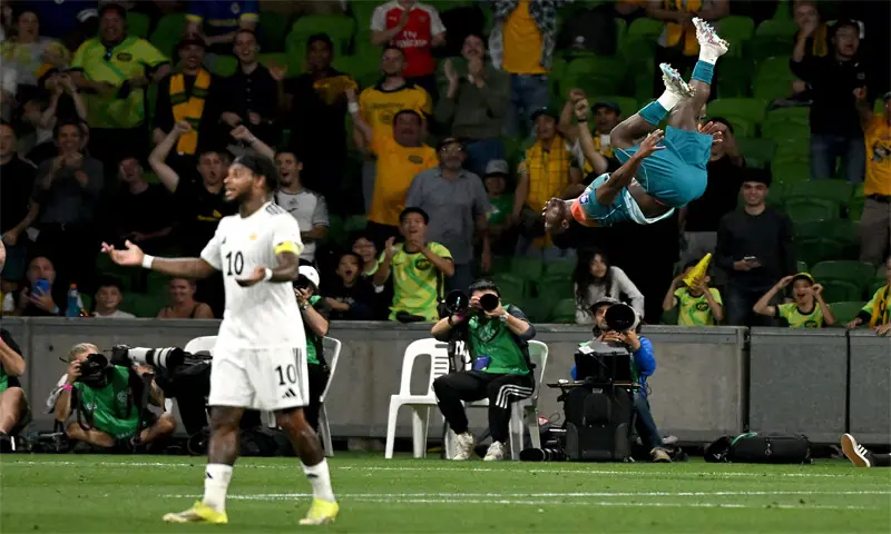 MELBOURNE: Australia’s Nestory Irankunda (R) celebrates after scoring as Curacao’s Leandro Bacuna reacts during their international friendly at the Melbourne Rectangular Stadium on Tuesday.—AFP MELBOURNE: Australia’s Nestory Irankunda (R) celebrates after scoring as Curacao’s Leandro Bacuna reacts during their international friendly at the Melbourne Rectangular Stadium on Tuesday.—AFP