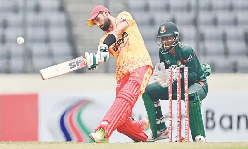 ZIMBABWE captain Sikandar Raza plays a shot as Bangladesh wicket-keeper Jakir Ali looks on during the fifth T20 International at the Sher-e-Bangla National Stadium on Sunday.—AFP ZIMBABWE captain Sikandar Raza plays a shot as Bangladesh wicket-keeper Jakir Ali looks on during the fifth T20 International at the Sher-e-Bangla National Stadium on Sunday.—AFP