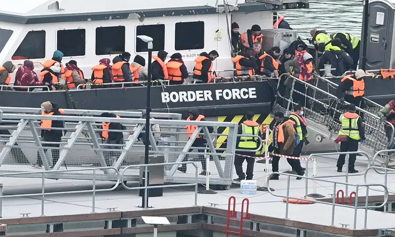 MIGRANTS step off a British border force vessel in Dover after being picked up at sea while attempting to cross the English Channel from France.—AFP MIGRANTS step off a British border force vessel in Dover after being picked up at sea while attempting to cross the English Channel from France.—AFP