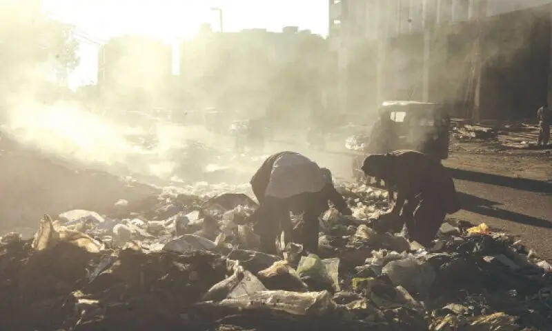 Smoke billows from a pile of garbage burning at a dumping site in Saddar Karachi.—Fahim Siddiqi / White Star/File Smoke billows from a pile of garbage burning at a dumping site in Saddar Karachi.—Fahim Siddiqi / White Star/File