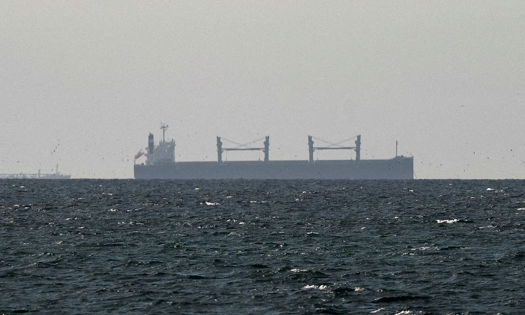 A cargo ship in the Gulf, near the Strait of Hormuz, as seen from northern Ras al-Khaimah in the United Arab Emirates, March 11. &mdash; Reuters/File