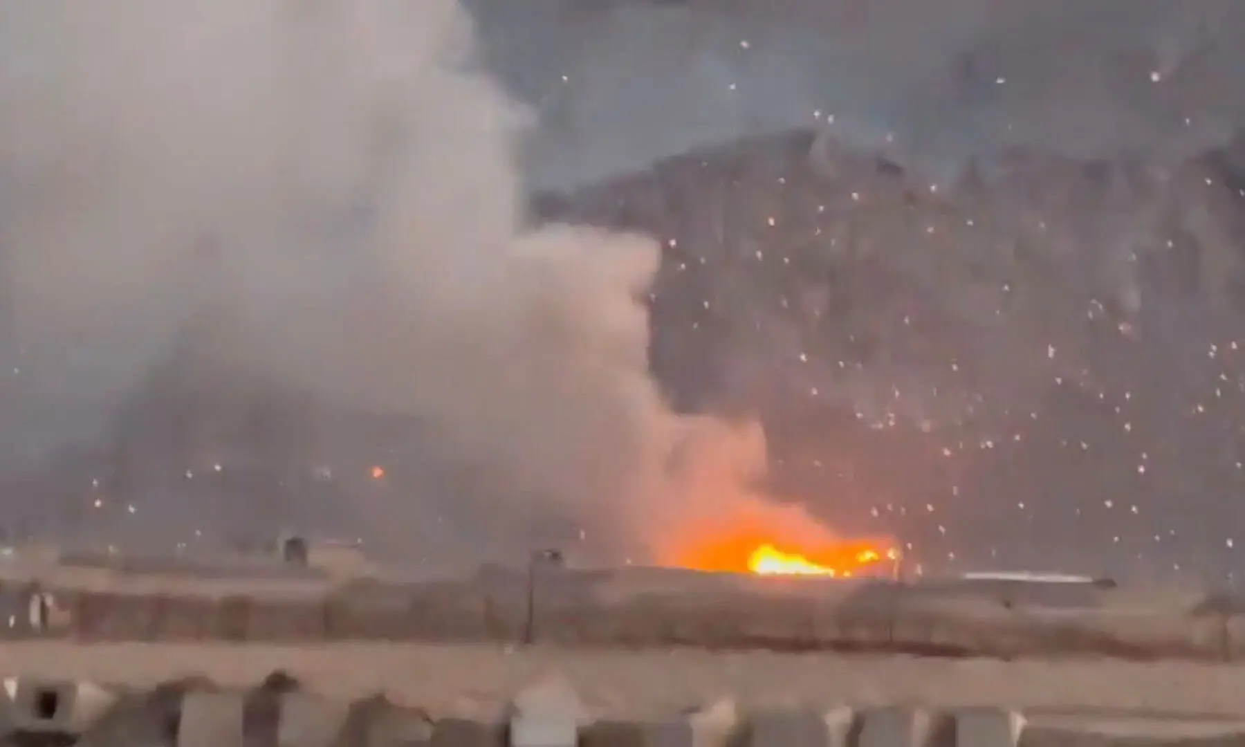 Smoke rises following a reported strike, as burning debris litters the surrounding area, amid the US-Israeli conflict with Iran, in Baharestan, Isfahan province, Iran in this screengrab taken from a social media video released on April 1. &mdash; Reuters