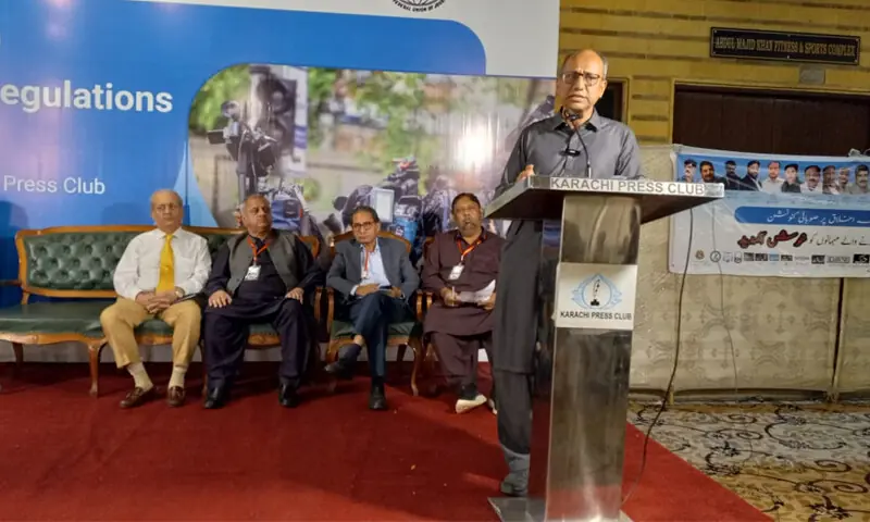 Labour Minister Saeed Ghani speaks as veteran politician Raza Rabbani, PFUJ president Afzal Butt and KUJ President Tahir Hasan Khan look on.&mdash;Dawn