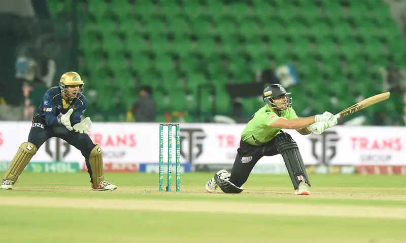 LAHORE Qalandars opener Mohammad Naeem plays a shot as Multan Sultans wicket-keeper Josh Phillippe looks on during their Pakistan Super League match at the Gaddafi Stadium on Friday.—Murtaza Ali/White Star LAHORE Qalandars opener Mohammad Naeem plays a shot as Multan Sultans wicket-keeper Josh Phillippe looks on during their Pakistan Super League match at the Gaddafi Stadium on Friday.—Murtaza Ali/White Star