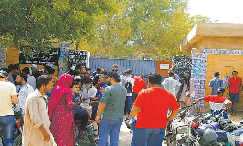 Parents and students gather outside a Matric examination centre in Malir, Karachi. —PPI/File Parents and students gather outside a Matric examination centre in Malir, Karachi. —PPI/File