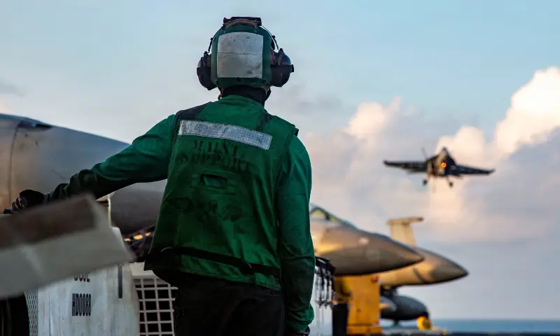A US Sailor observes flight operations as an F/A-18E Super Hornet, attached to Strike Fighter Squadron 14, prepares to make an arrested landing on the flight deck of Nimitz-class aircraft carrier USS Abraham Lincoln supporting Operation Epic Fury during the Iran war at an undisclosed location on March 26, 2026. — Reuters A US Sailor observes flight operations as an F/A-18E Super Hornet, attached to Strike Fighter Squadron 14, prepares to make an arrested landing on the flight deck of Nimitz-class aircraft carrier USS Abraham Lincoln supporting Operation Epic Fury during the Iran war at an undisclosed location on March 26, 2026. — Reuters