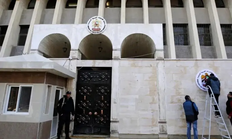 A security guard stands in front of the UAE embassy in Damascus during its reopening in 2018. &mdash; Reuters/File