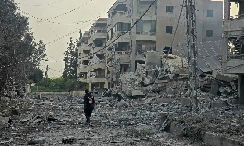 A man walks through the debris of destroyed buildings at the site of an Israeli airstrike in the Al Hosh area near the coastal Lebanese city of Tyre on April 4. — AFP A man walks through the debris of destroyed buildings at the site of an Israeli airstrike in the Al Hosh area near the coastal Lebanese city of Tyre on April 4. — AFP