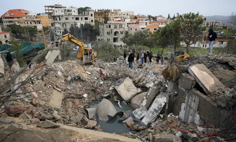 People gather at the site of an Israeli strike, in Kfar Hatta in southern Lebanon, April 5, 2026. — Reuters