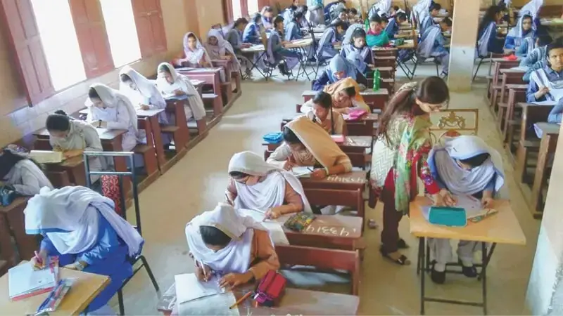 Students busy solving their paper at an examination centre .—PPI/File Students busy solving their paper at an examination centre .—PPI/File