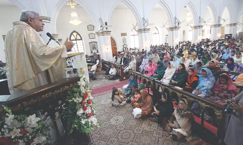 A priest addresses an Easter congregation at St John&rsquo;s Cathedral, Peshawar, on Sunday. &mdash; White Star