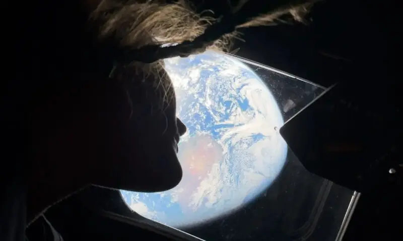 This handout picture by an Artemis II crew member provided by NASA shows Artemis II mission specialist Christina Koch looking back at earth through the window of the Orion spacecraft on April 2, 2026. —AFP This handout picture by an Artemis II crew member provided by NASA shows Artemis II mission specialist Christina Koch looking back at earth through the window of the Orion spacecraft on April 2, 2026. —AFP