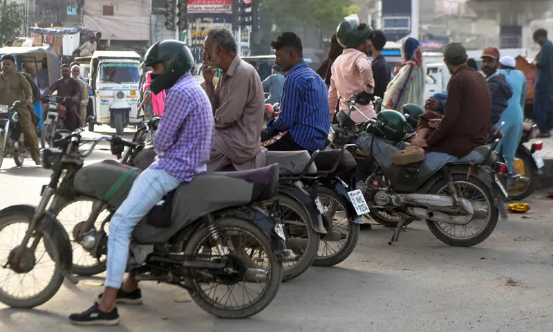 Following an unprecedented hike in prices of petroleum products, motorcyclists wait for their offline rides at a city area on Tuesday. Minister Sharjeel Memon says there are 6.7m registered bikes and the Sindh government is providing Rs2,000 fuel subsidy to each of them.—Fahim Siddiqi / White Star Following an unprecedented hike in prices of petroleum products, motorcyclists wait for their offline rides at a city area on Tuesday. Minister Sharjeel Memon says there are 6.7m registered bikes and the Sindh government is providing Rs2,000 fuel subsidy to each of them.—Fahim Siddiqi / White Star