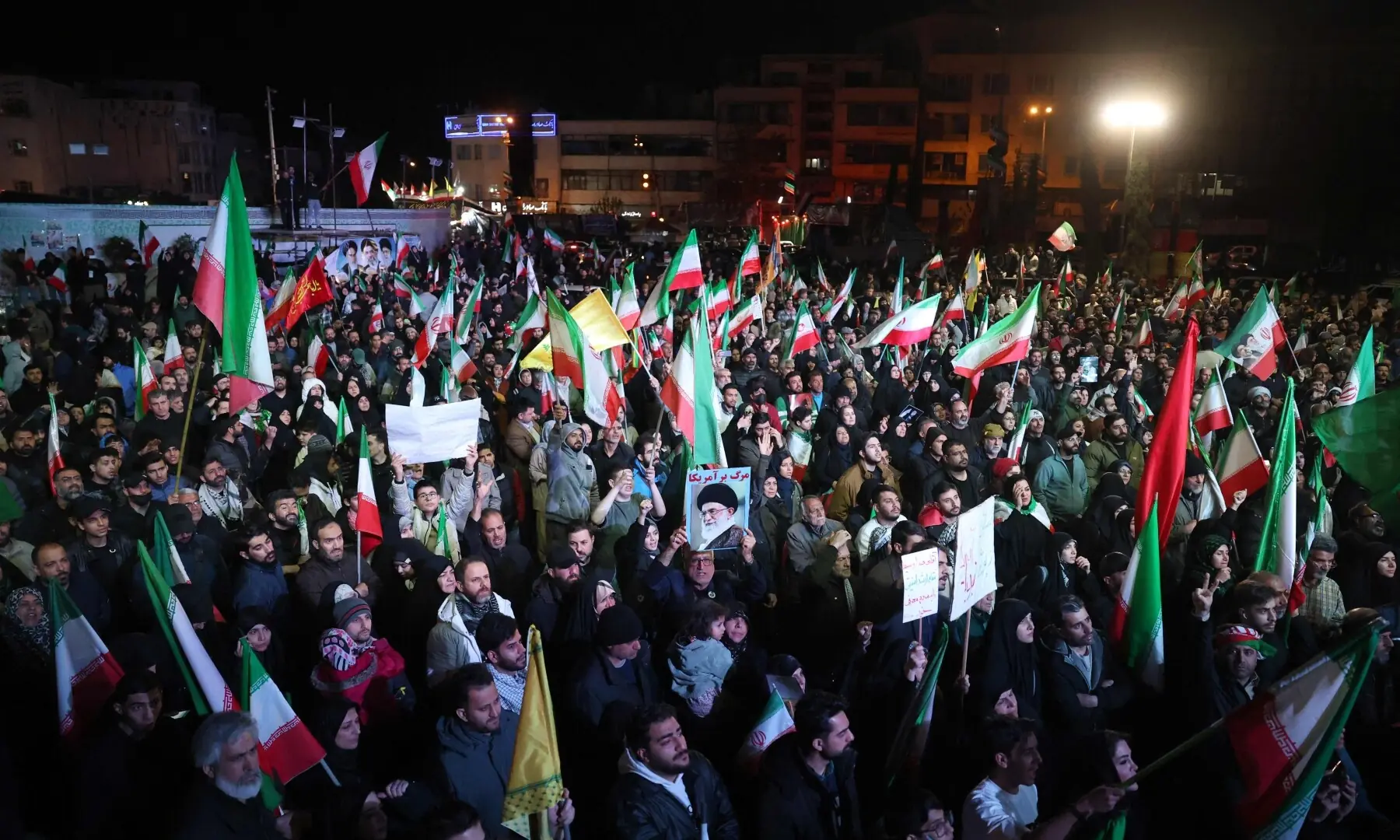 Iranians react after a ceasefire announcement at the Enqelab square, in Tehran, on April 8 2026. &mdash;AFP