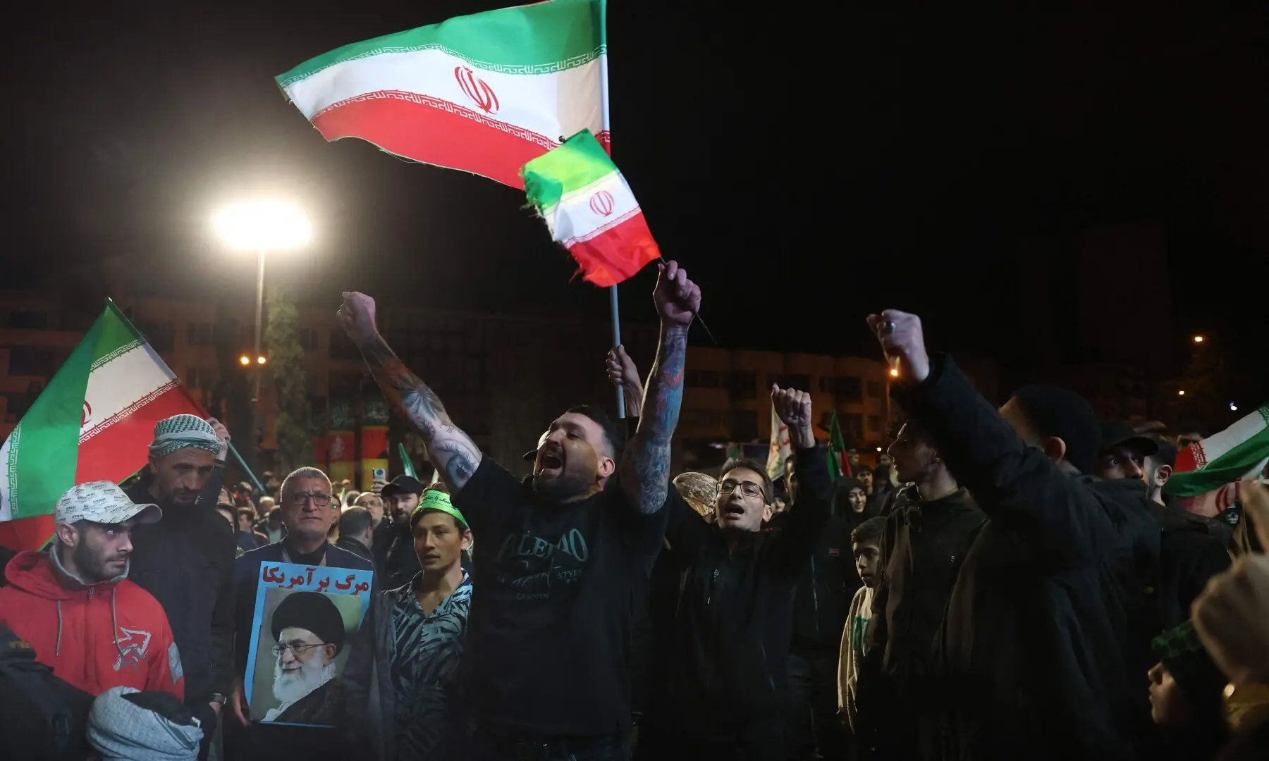 Iranians react after a ceasefire announcement at the Enqelab square, in Tehran, on April 8 2026. &mdash;AFP