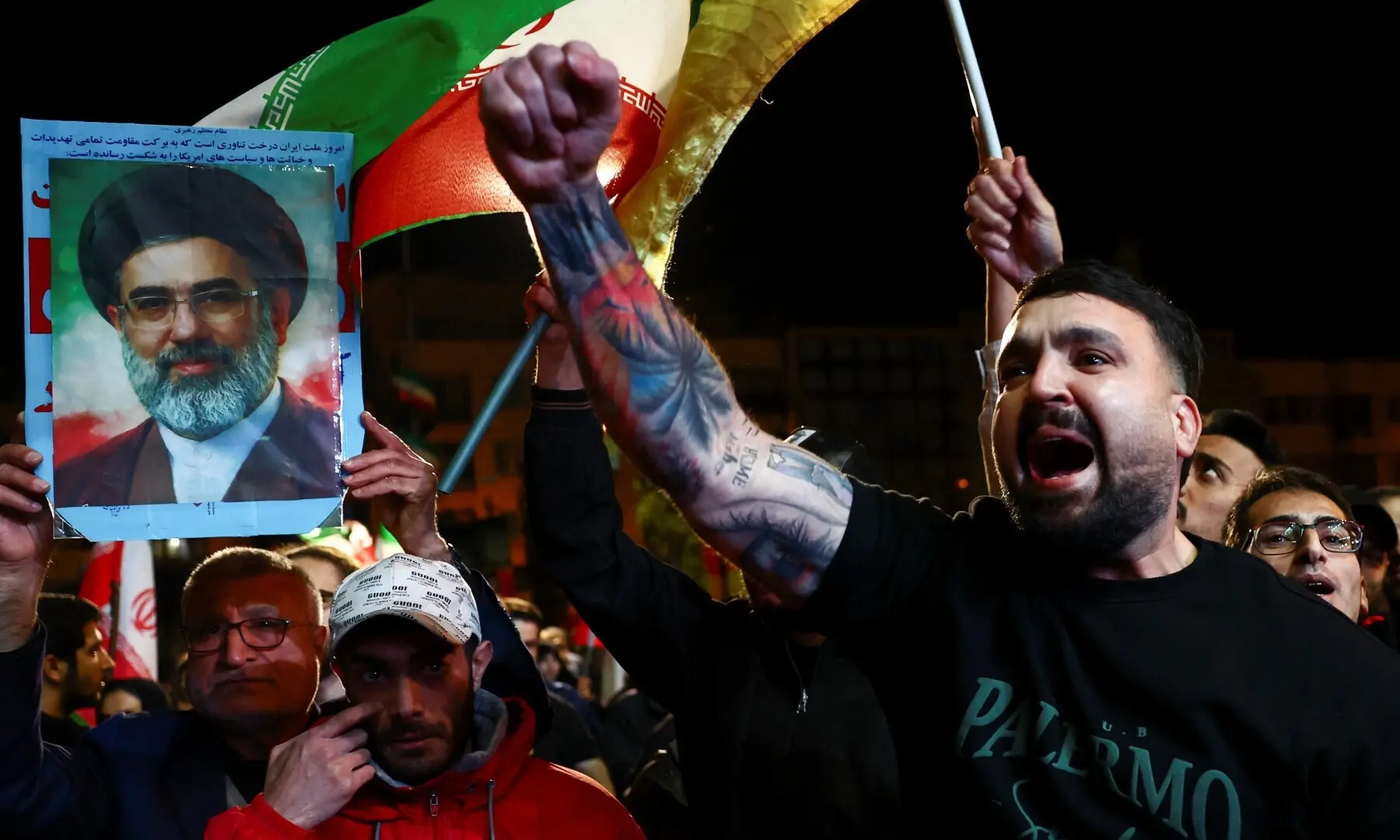 A man shouts slogans as people gather after a two-week ceasefire in the Iran war was announced, in Tehran, Iran, April 8, 2026. &mdash;Reuters