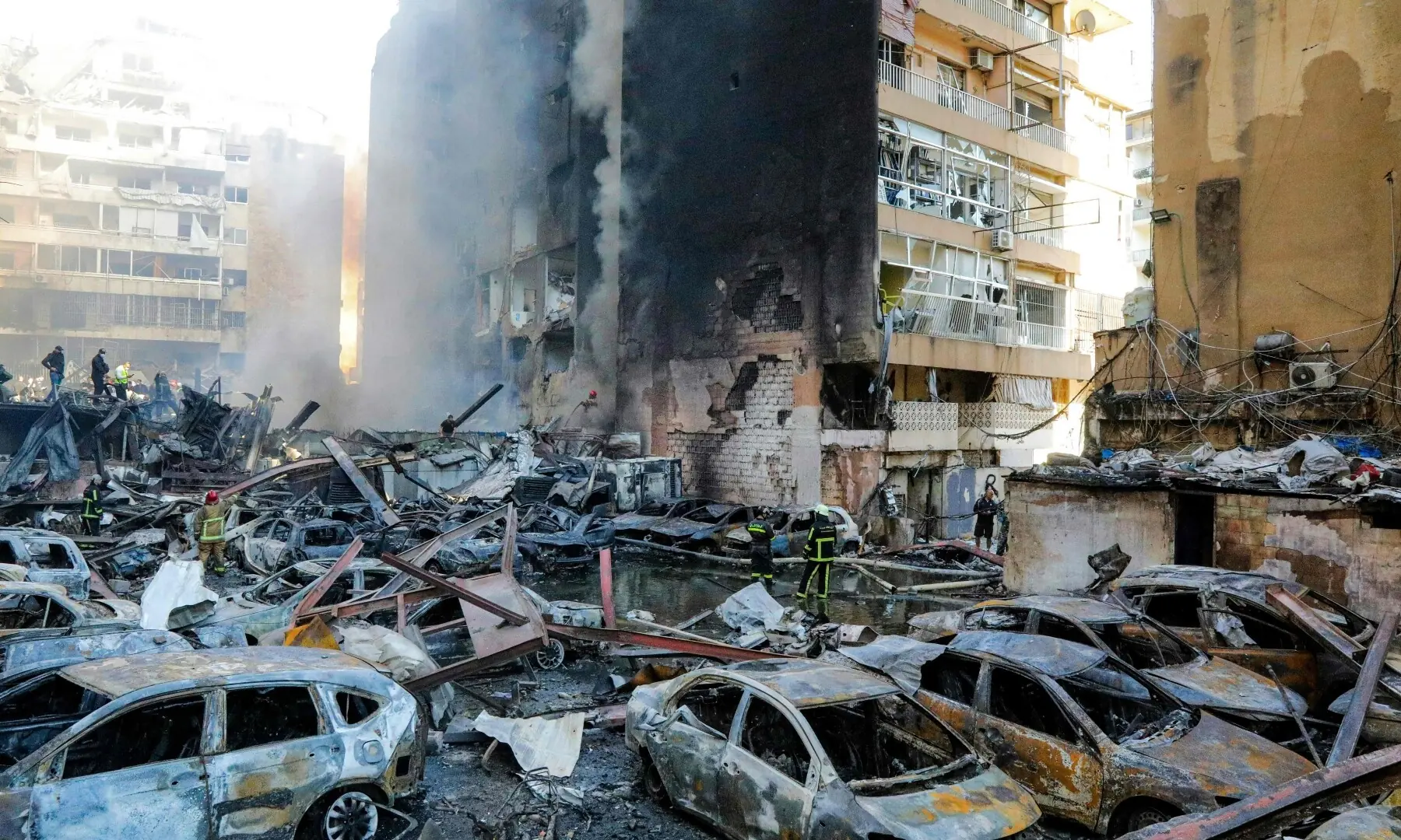 Firefighters attempt to extinguish a fire following an Israeli strike at the Corniche al-Mazraa neighbourhood of Beirut on April 8. &mdash; AFP