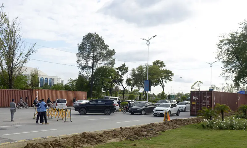 Traffic being diverted at Serena Chowk on Wednesday as part of security measures for US-Iran talks in Islamabad. — Photo by Mohammad Asim Traffic being diverted at Serena Chowk on Wednesday as part of security measures for US-Iran talks in Islamabad. — Photo by Mohammad Asim