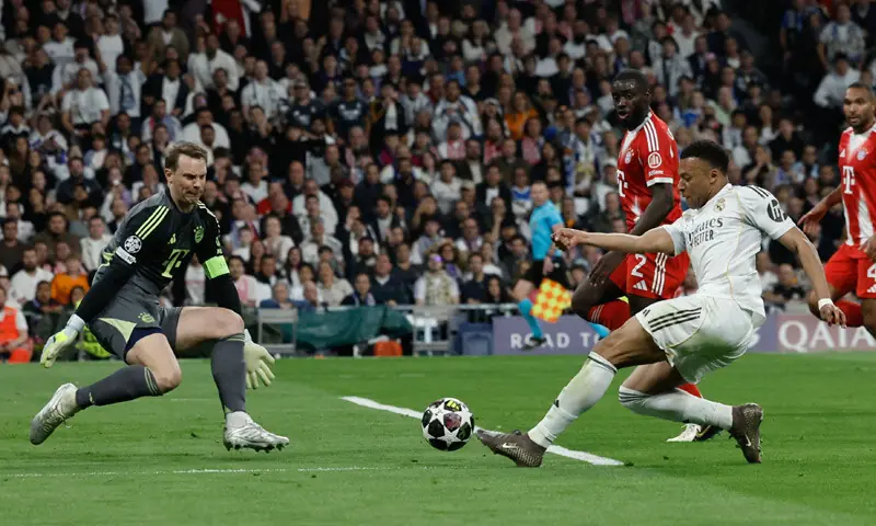 MADRID: Real Madrid’s Kylian Mbappe shoots but fails to score past Bayern Munich goalkeeper Manuel Neuer during their Champions League quarter-final first leg at Santiago Bernabeu.—AFP MADRID: Real Madrid’s Kylian Mbappe shoots but fails to score past Bayern Munich goalkeeper Manuel Neuer during their Champions League quarter-final first leg at Santiago Bernabeu.—AFP