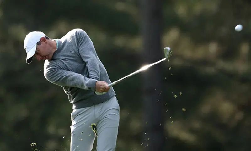 RORY McIlroy of Northern Ireland plays an approach shot on the 15th hole during a practice round at the Augusta National Golf Club on Wednesday.—AFP RORY McIlroy of Northern Ireland plays an approach shot on the 15th hole during a practice round at the Augusta National Golf Club on Wednesday.—AFP