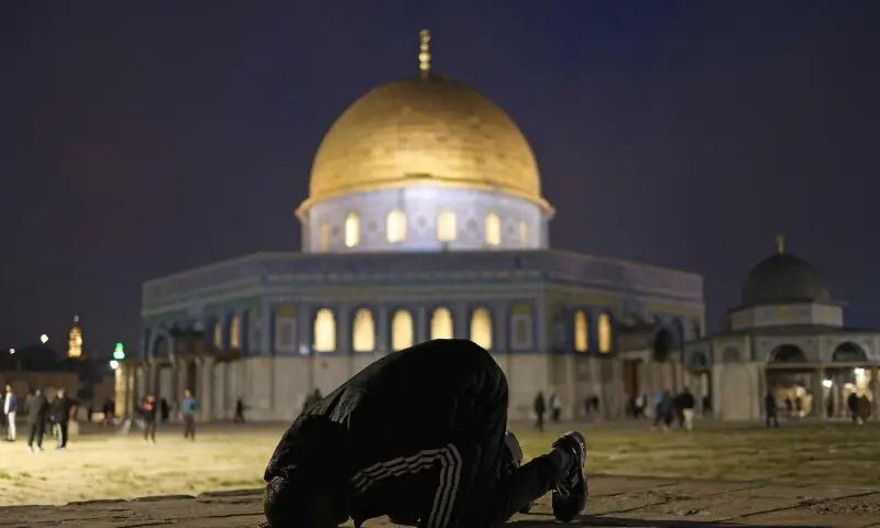 Worshippers gather near the Dome of the Rock at the Al-Aqsa Mosque compound for the fajr dawn prayer in Jerusalem on April 9, 2026. &mdash;AFP