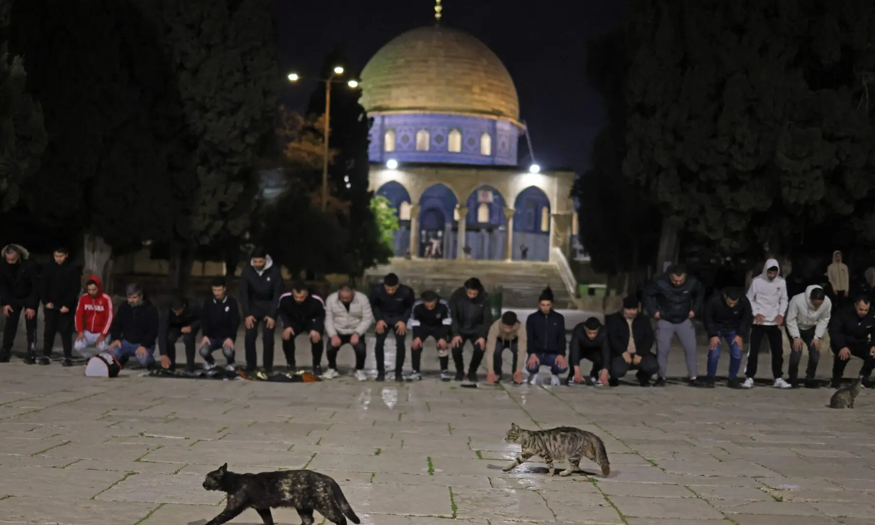 Worshippers gather near the Dome of the Rock at the Al-Aqsa Mosque compound for the dawn prayers in Jerusalem on April 9, 2026. &mdash;Reuters