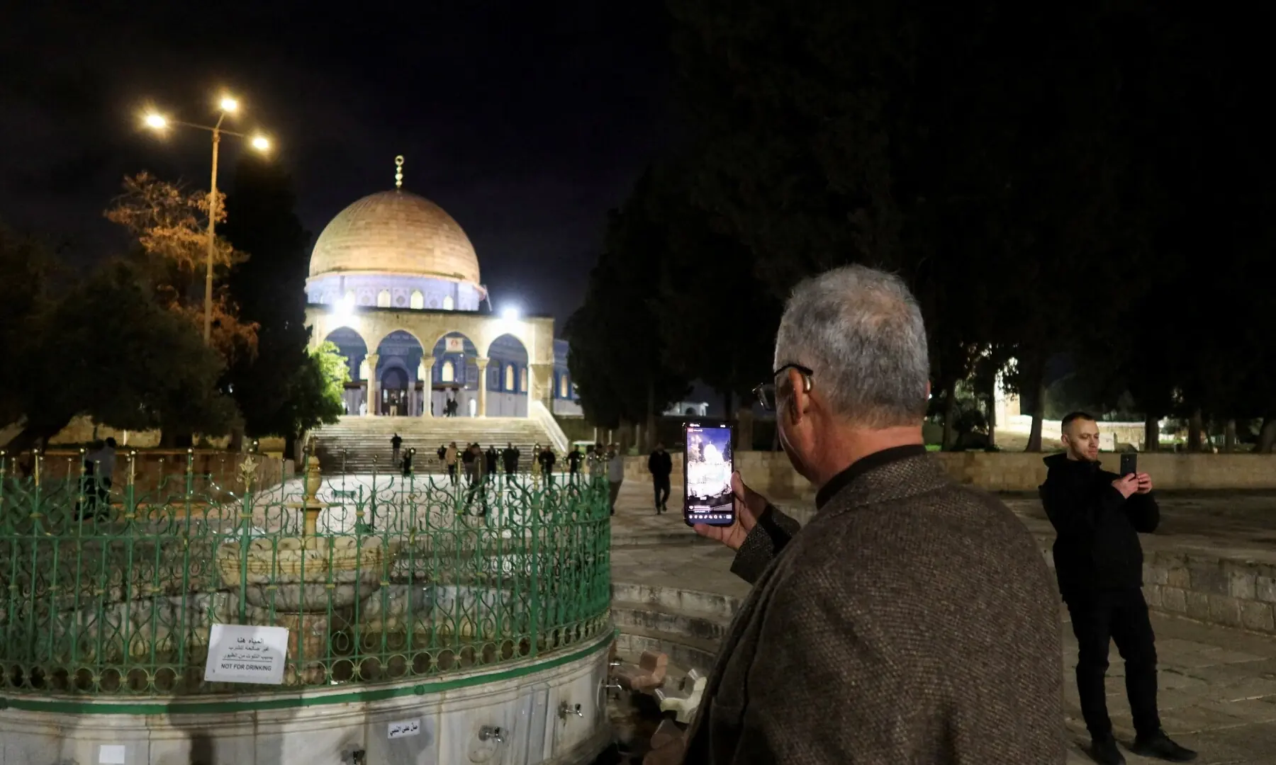 Worshippers use their phones in front of the Dome of the Rock, as they arrive to attend early morning prayers at Al-Aqsa compound, also known to Jews as the Temple Mount, amid a two-week ceasefire in the Iran war, in Jerusalem on April 9, 2026. &mdash;Reuters