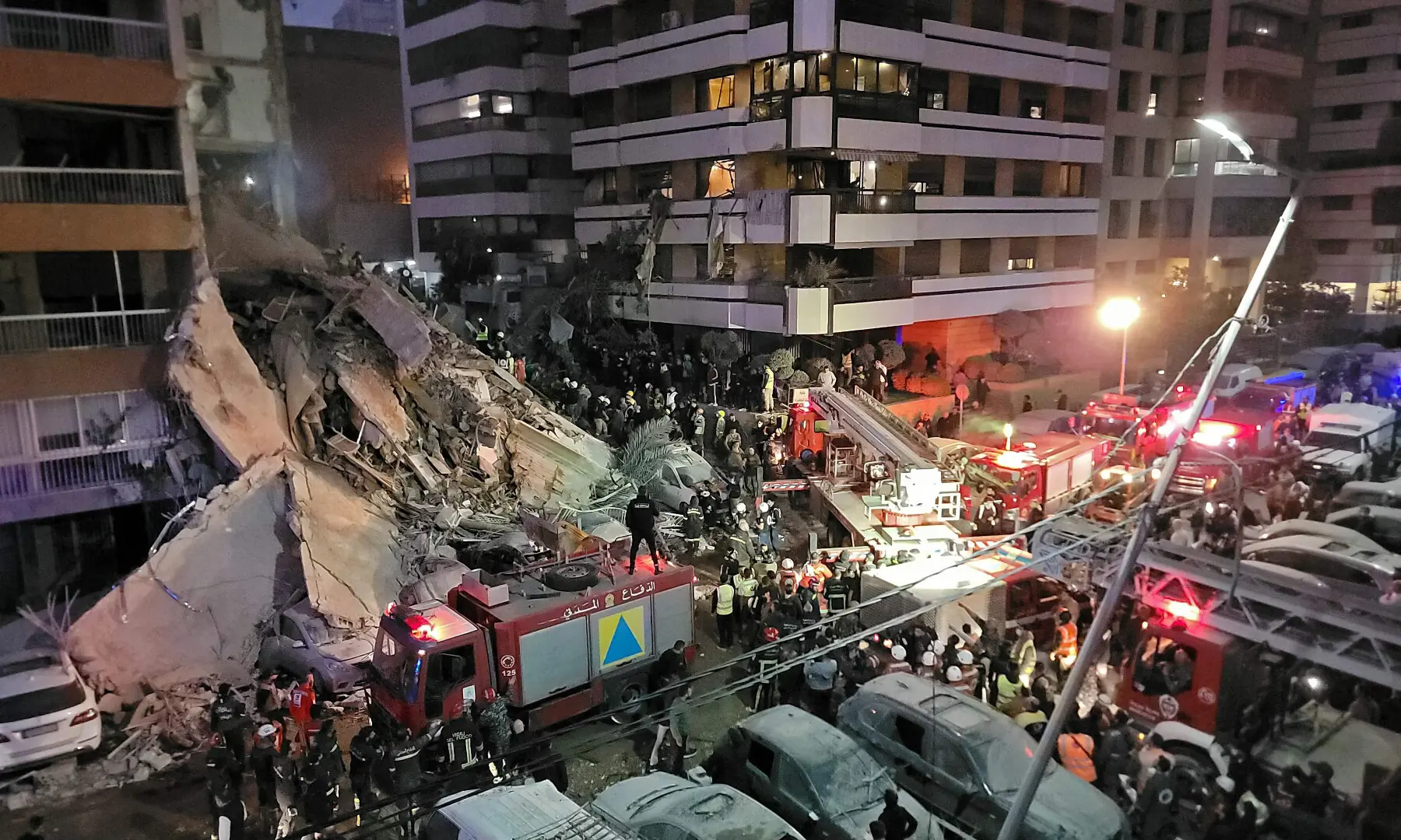 First responders and residents gather at the site of an Israeli airstrike in Beirut&rsquo;s Tallet al-Khayyat neighbourhood, on April 8, 2026. &mdash; AFP