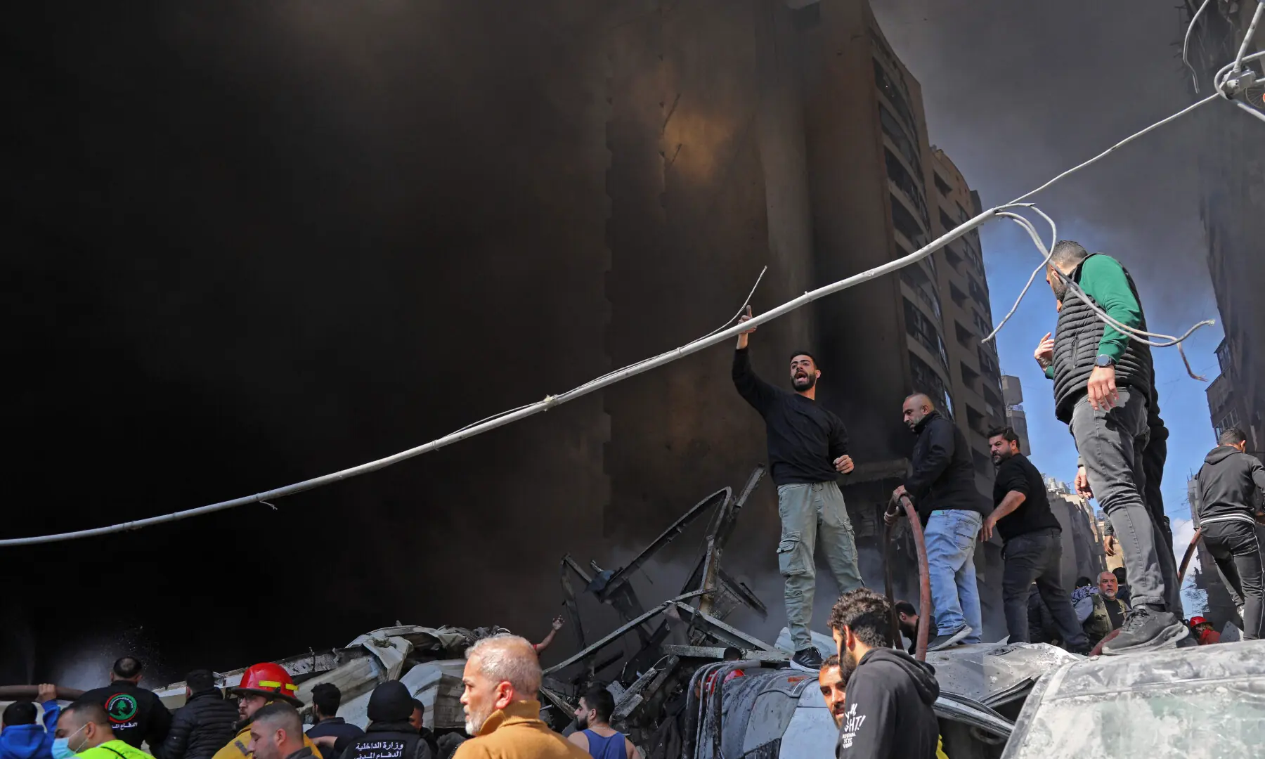 First responders and residents gather amid the rubble at the site of an Israeli airstrike in Beirut&rsquo;s Corniche al-Mazraa neighbourhood, on April 8, 2026. &mdash; AFP