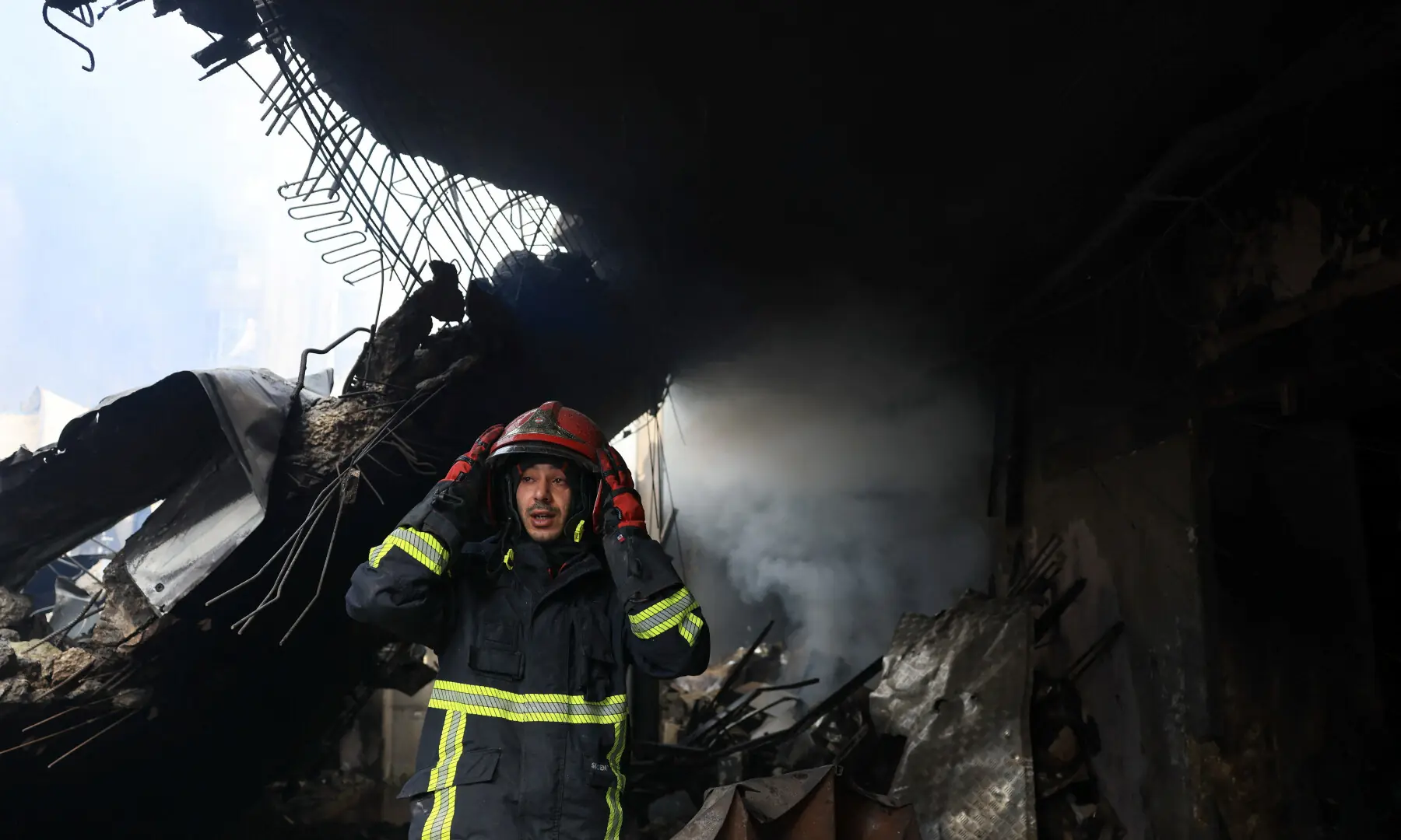 A firefighter looks on at the site of an Israeli strike carried out on Wednesday, in Al-Mazraa in Beirut, Lebanon on April 9, 2026. &mdash; Reuters