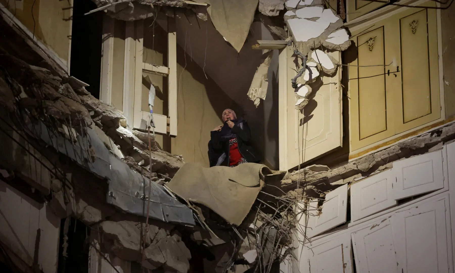 A woman trapped in a damaged building waits to be rescued following an Israeli strike, in Beirut, Lebanon on April 8, 2026. &mdash; Reuters
