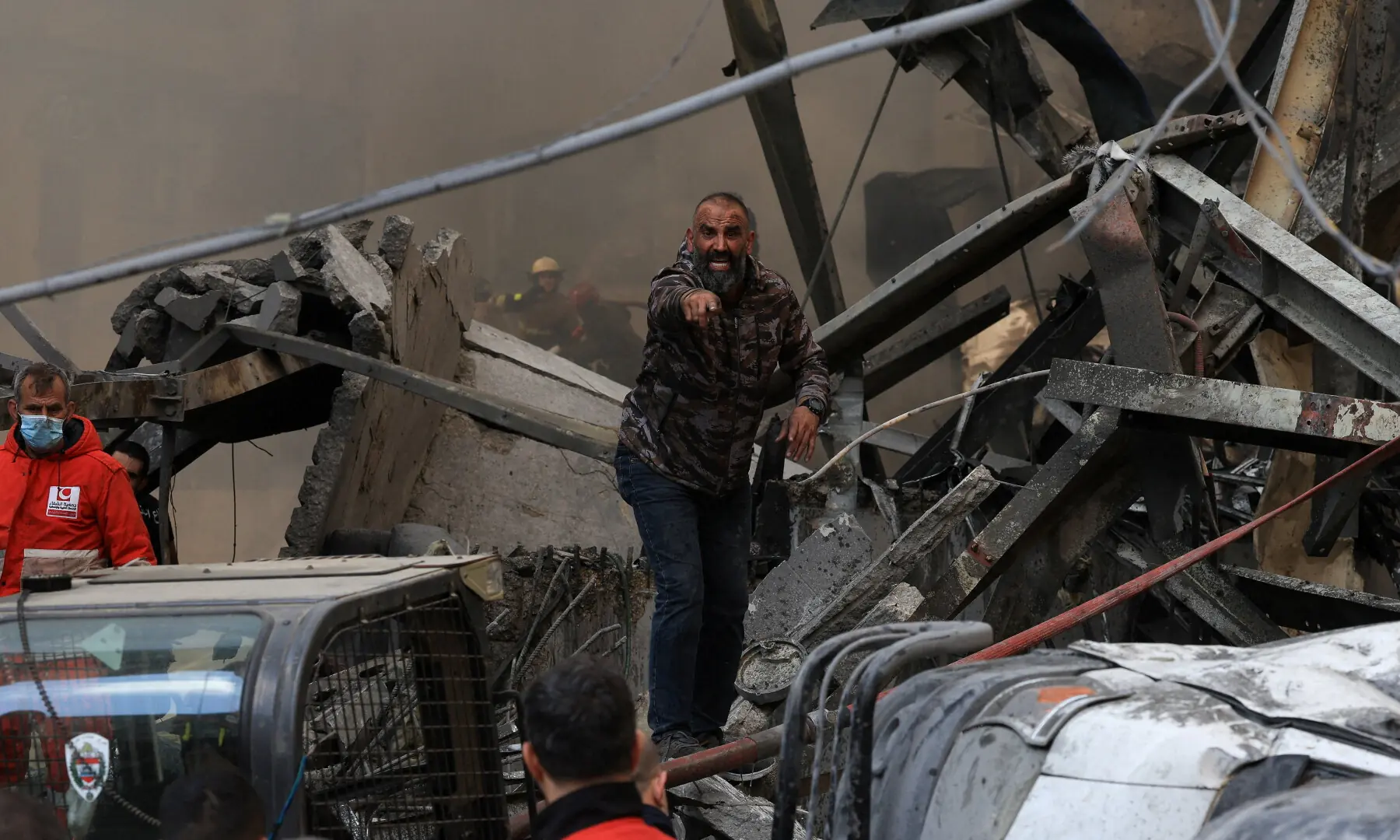 A man gestures as rescuers work at the site of an Israeli strike in Beirut, Lebanon on April 8, 2026. &mdash; Reuters