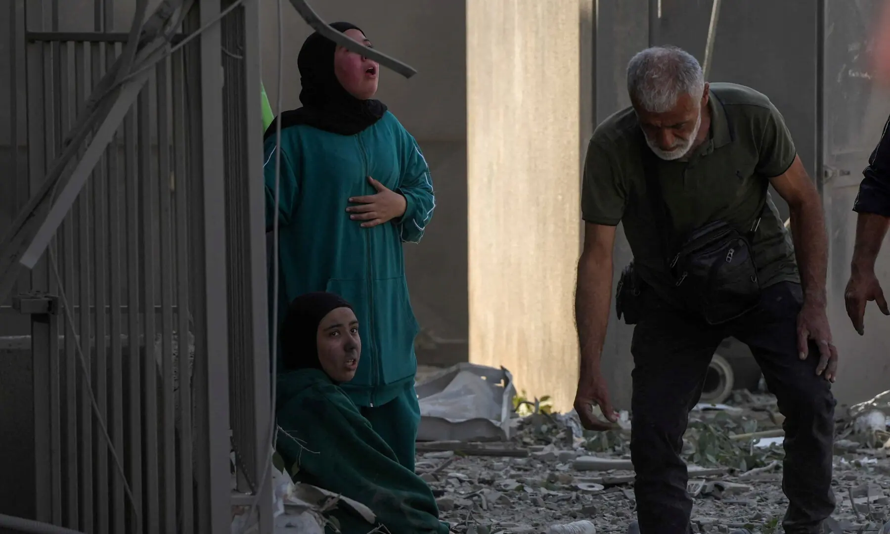 People amid rubble at the site of an Israeli strike in Sidon, Lebanon on April 8, 2026. Picture taken with a mobile phone. &mdash; Reuters
