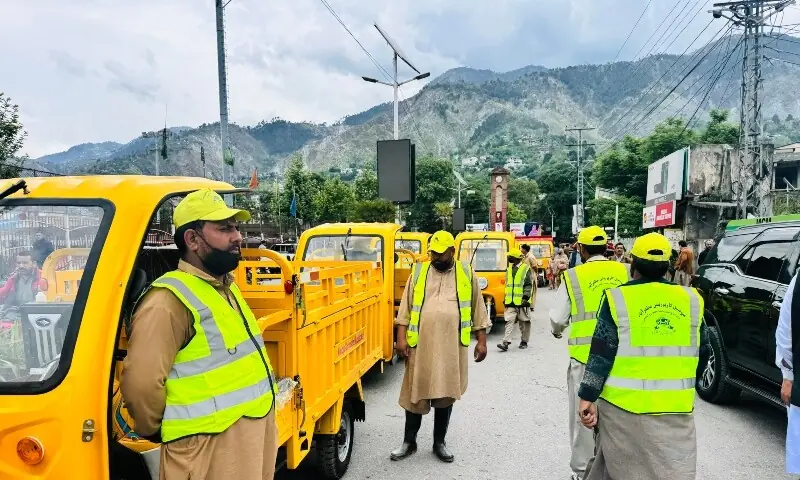 Newly inducted arm-loader rickshaws stand lined up outside the Municipal Corporation in Muzaffarabad on the occasion of the inauguration of the Integrated Solid Waste Management system, marking a step towards improved urban sanitation services. &mdash;Photo by Tariq Naqash
