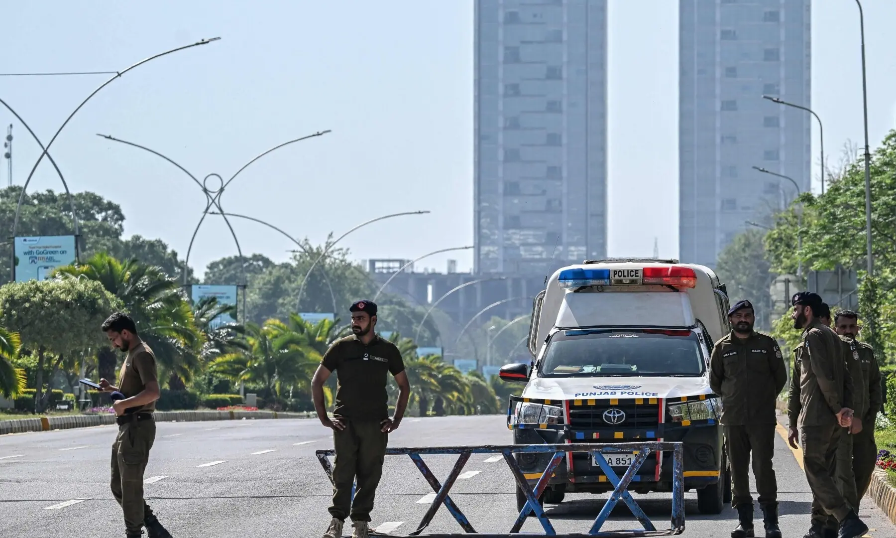 Security personnel keep watch along the cordon street near the expected venue of the US-Iran talks in the Red Zone area of Islamabad on April 10, 2026. &mdash;AFP