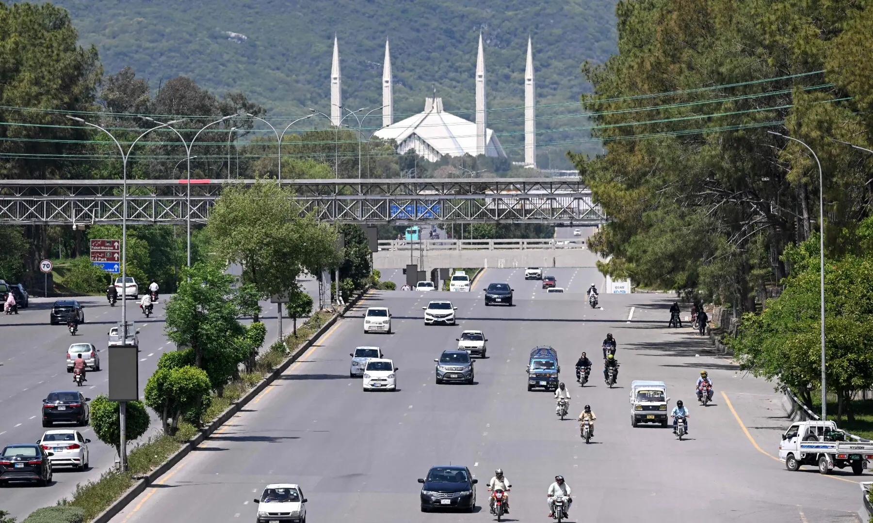 Commuters travel along a road in Islamabad on April 10, 2026. &mdash;AFP