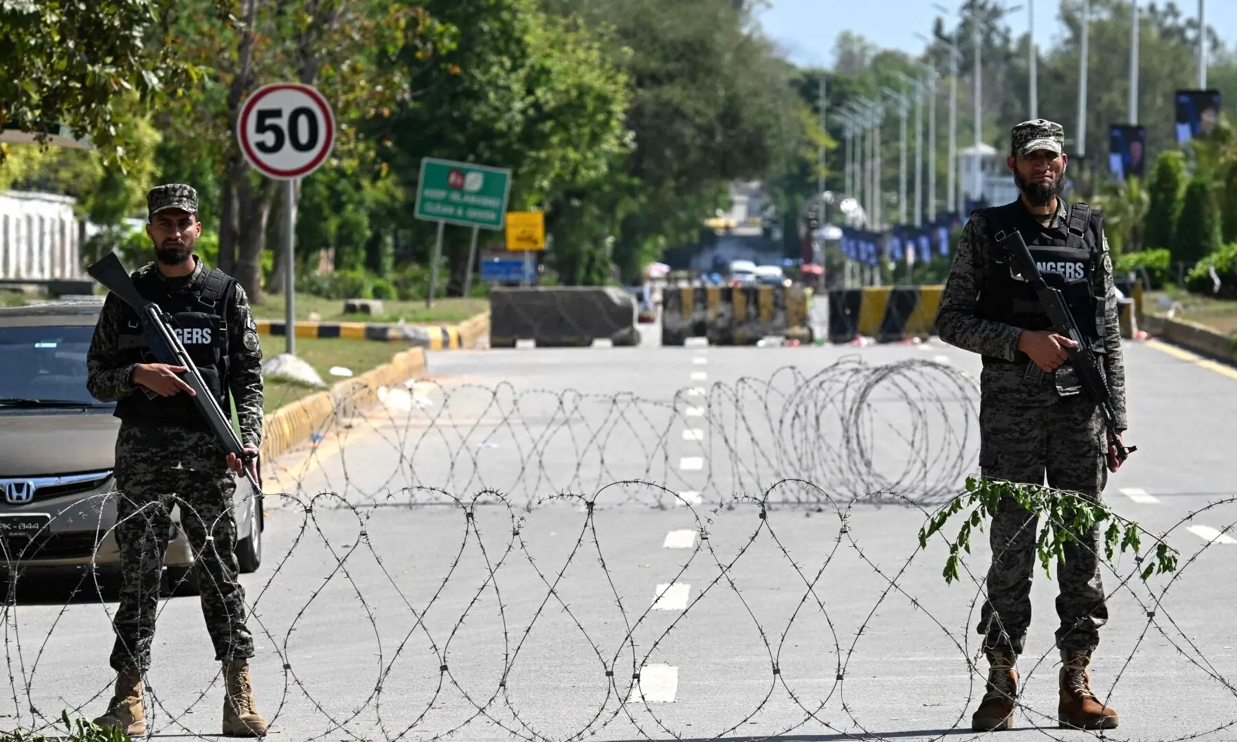 Security personnel stand guard along the cordon street near the expected venue of the US-Iran talks in the Red Zone area of Islamabad on April 10, 2026. &mdash;AFP