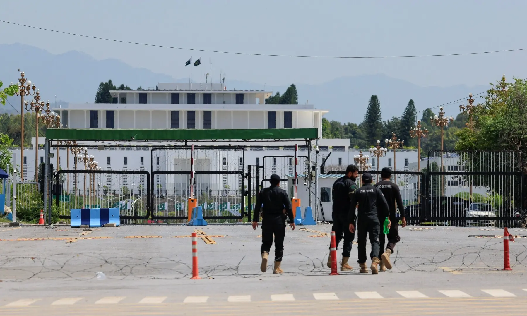 Police officers walk towards the President house, as Pakistan prepares to host the US and Iran for peace talks, in Islamabad, Pakistan, April 10, 2026. &mdash;Reuters