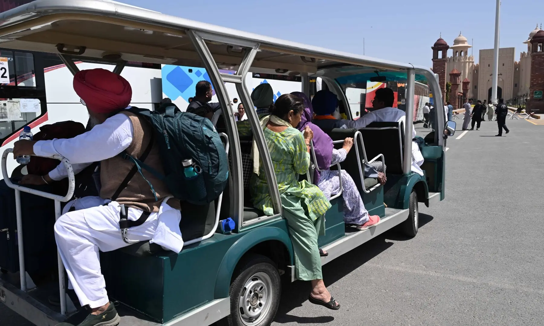 A shuttle transports Sikh pilgrims as they arrive in Pakistan from India via Wagah border on April 10, 2026. &mdash; White Star/Arif Ali